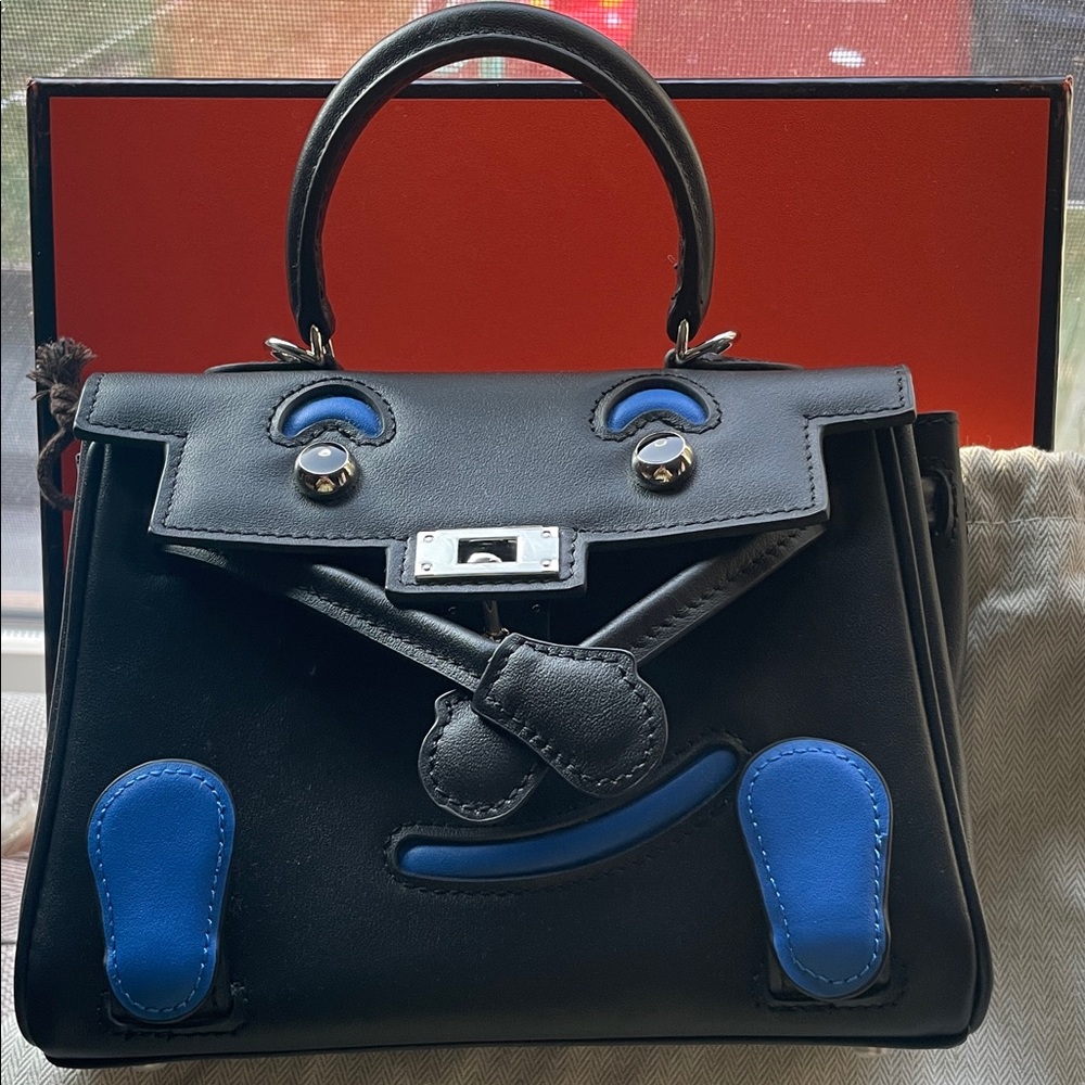 Black Leather Kelly doll Top-Handle Bag with Blue Accent Smiley Face